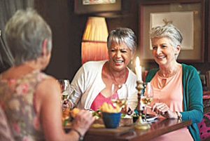 Cropped shot of a group of senior female friends enjoying a lunch date